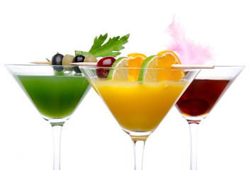 Composition with a orange, cherry and green vegetables cocktails