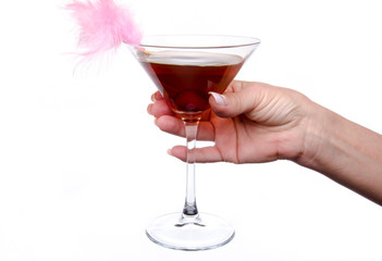 Woman's hand holding a cherry cocktail