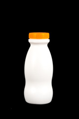 white plastic bottle with orange cover on top