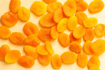 Healthy diet. Dried apricots set on wooden table .