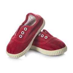 calzado informal zapatillas infantiles rojas aisladas en blanco