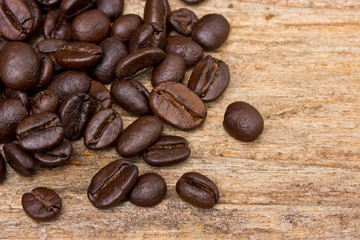 Coffee beans on wood background
