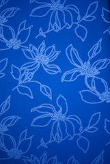 Fototapeta na wymiar An exotic blue color floral pattern weaved fabric