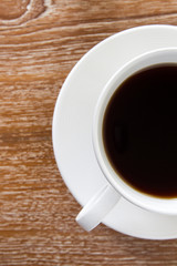 Cup of coffee on wooden table