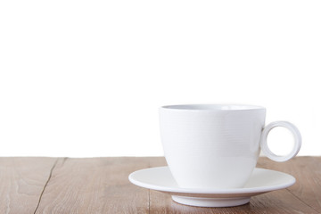 Cup of coffee on wooden table