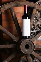 Fototapeta na wymiar Red wine on wooden wheel
