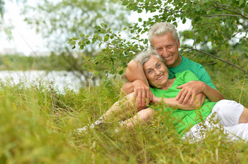 Senior couple in summer field