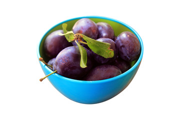 plums in bowl isolated