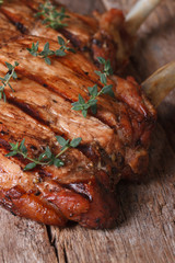 two hot juicy pork steak with thyme vertical close-up