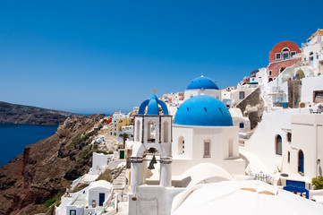 Oia church with blue domes and the bell. Santorini, Greece