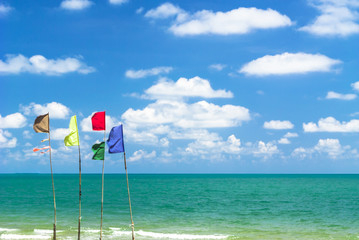 Multi color flags on the beach.