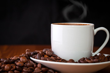 cup of coffee against dark background