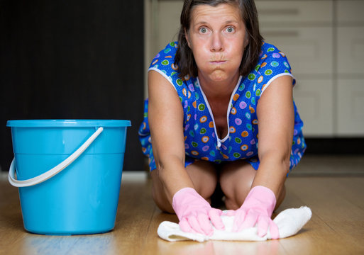 woman scrubbing the floor