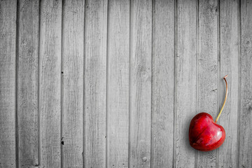 Red cherry on a wooden background