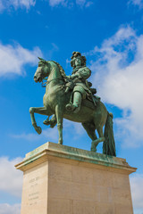 Fototapeta na wymiar Statue of Louis XIV, Sun King of France in Versailles