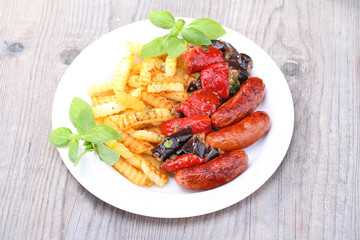 Sausage with potato on the wooden table