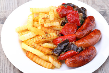 Portion of sausage with tomato