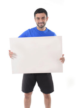 young attractive sport man holding blank billboard as copy space