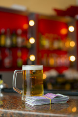 mug of beer and money