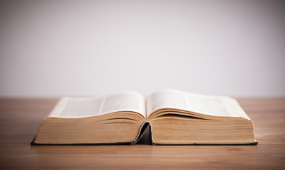 Open book on wooden deck