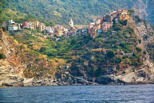 Scenic view of colorful village Vernazza and ocean coast in Cinq