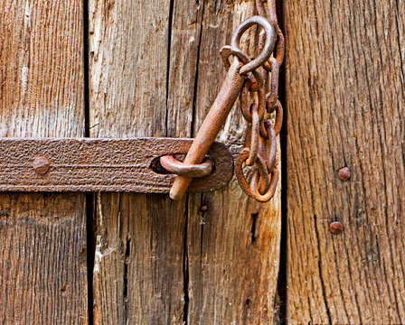 The iron latch on wooden door