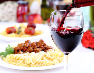 Pouring red wine and food background - 68912751