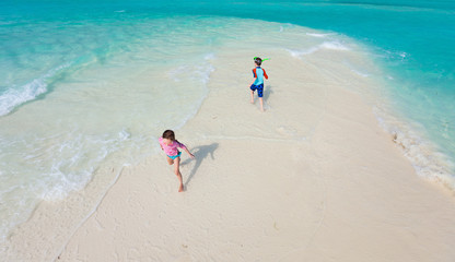 Kids running at beach