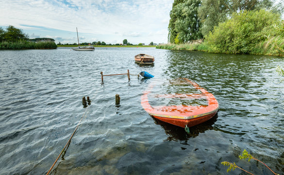 Sunken Orange Colored Row Boat