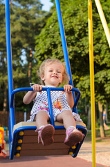 girl riding on Swings