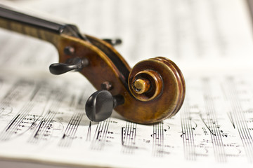 beautiful violin on a sheet music background - 68918397