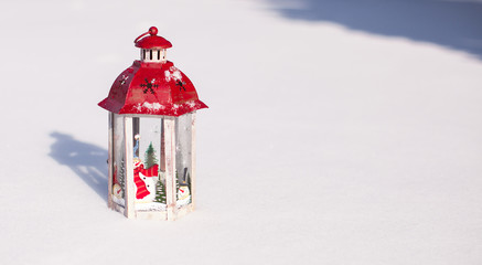 Decorative Christmas lantern in snow winter day