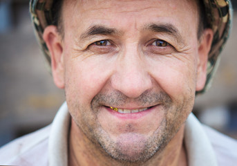 Portrait of happy middle aged smiling man