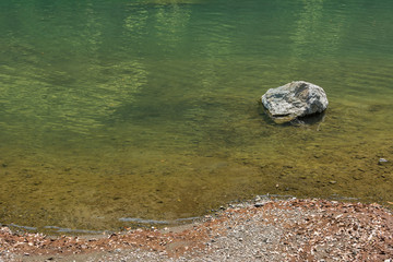 one stone in a river in nobody outdoors