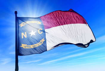 Naklejka premium North Carolina (USA) flag waving on the wind