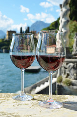 Two wineglasses. Varenna town at the lake Como, Italy