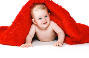 Portrait joyful positive baby with a towel, health and hygiene -