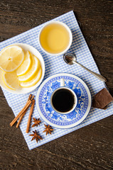 espresso in blue cup with lemon and honey on table