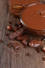Sweet chocolate cream in bowl on table close-up