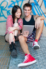 Young multi-ethnic couple using a tablet pc.