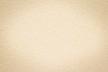 beige colored house front, structured with spatula techniques, b