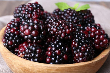 Wooden bowl of blueberries