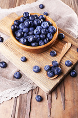 Wooden bowl of blueberries