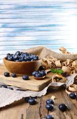 Wooden bowl of blueberries