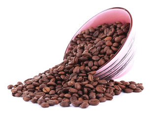 Coffee beans in big lilac bowl isolated on white