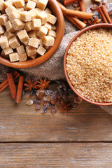 Brown sugar cubes, reed and crystal sugar in bowl with spices