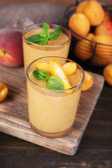 Apricot dessert in glasses on table close-up