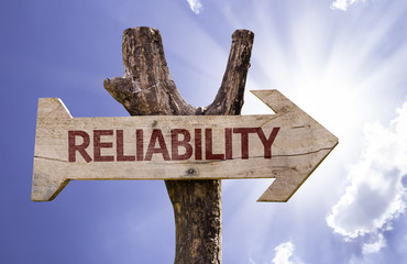 Reliability wooden sign with sky background