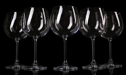 Empty wine glasses isolated on black