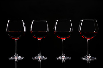 Glasses of wine isolated on black
